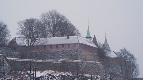View-Of-Outside-Walls-Of-Akershus-Fortress-On-Snow-Winters-Day-In-Oslo