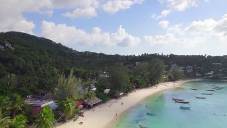4k-Aerial-Drone-Footage-Push-Forward-Shot-of-Salad-Beach-on-Koh-Phangan-in-Thailand-with-Fishing-Boats,-Teal-Water,-Coral,-and-Green-Jungles
