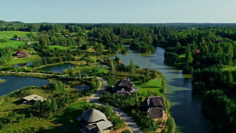 Luxury-estate-village-surrounded-by-lakes-and-woodland,-aerial-view