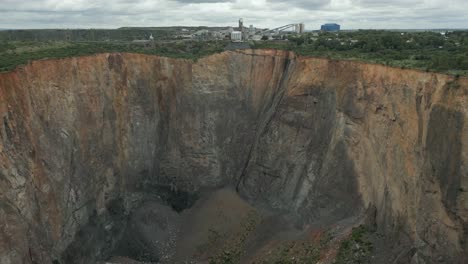 Dramatic-aerial-flyover-of-abandoned-open-pit-of-Cullinan-Diamond-Mine
