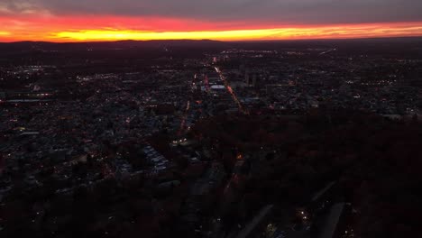 Aerial-truck-shot-of-Reading-PA-during-beautiful-red-and-orange-autumn-sunset