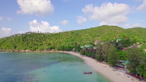 4k-Aerial-Drone-Push-Forward-Shot-of-Salad-Beach-on-Koh-Phangan-in-Thailand-with-Fishing-Boats,-Teal-Water,-Coral,-and-Green-Jungles