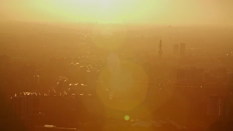 Silhouette-of-Milan-city-during-golden-sunset-or-sunrise-with-lens-flare