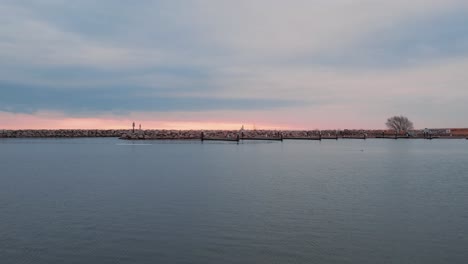 Milwaukee-breakwater-light,-captured-at-sunrise,-historical-landmark-in-Wisconsin,-cinematic-shot