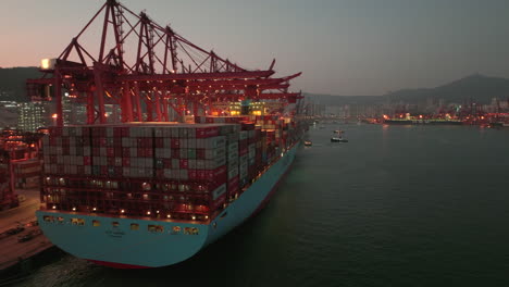 E-class-vessel-Elly-Maersk-in-cargo-operation-at-Modern-Terminals-in-Hong-Kong-after-sunset