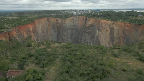 Aerial-retreat-from-rim-of-Cullinan-Diamond-Mine-big-hole-in-S-Africa