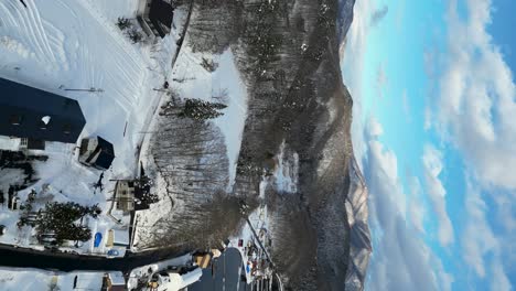 Aerial-view-of-mountains-by-Lake-Nojiri,-Nagano,-portrait-video