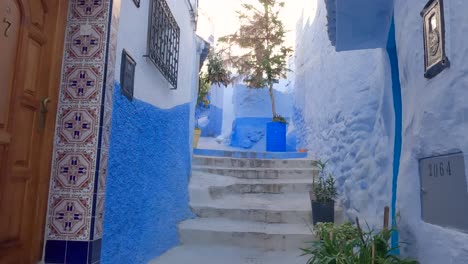 POV-walking-picturesque-blue-alleys-of-Chefchaouen,-Morocco