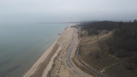 Still-Aerial-of-Beach-Street,-now-closed-for-Winter,-covered-in-sand-and-snow