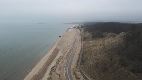 A-high-aerial-of-Pere-Marquette,-closed-for-Winter,-after-a-heatwave-thaw