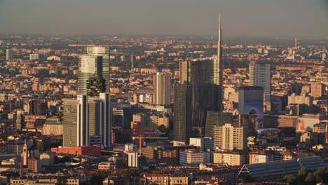 Porta-Nuova-of-Milan-city-during-golden-sunset,-view-from-above
