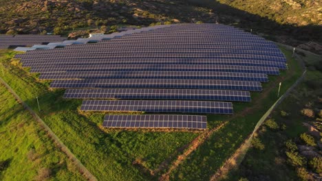 Establisher-aerial-view-of-large-Photovoltaic-power-station,-green-energy