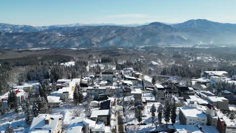Tilt-up-aerial-reveal-of-Akakura-Onsen-ski-resort