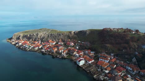 Peninsula-of-Lin-near-Pogradec-with-rocky-hill-and-village-houses-built-on-shore-of-Ohrid-lake