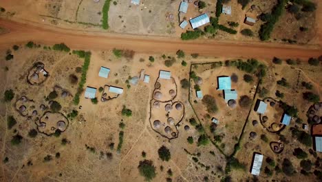 Panoramic-aerial-view-of-an-area-of-Karamoja,-Uganda-where-there-are-traditional-houses-of-the-region