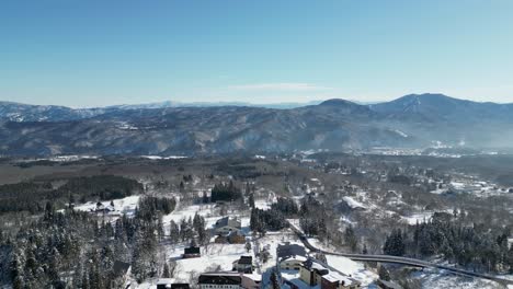 Aerial-view-of-snowy-mountain-range-in-Niigata,-Japan