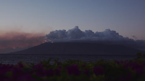 Beautiful-view-of-a-volcano-hidden-in-clouds-in-Maui,-Hawaii-at-sunset