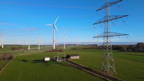 Clean-Energy-Generation:-Drone-Shot-of-Rotating-Windmills-and-Power-Line-in-Brilon,-North-Rhine-Westphalia