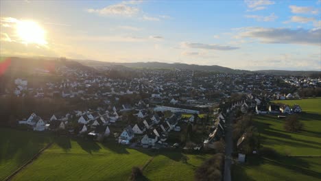 Winter-Sunset-in-Warstein:-Drone-Footage-of-the-Town-Nestled-in-the-Majestic-Sauerland-Mountains