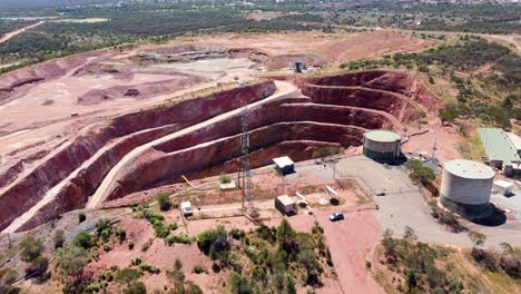 Aerial-drone-shot-landscape-view-water-tank-copper-ore-mine-pit-mining-town-industry-travel-tourism-outback-NSW-Cobar-Fort-Bourke-Hill-Australia-4K