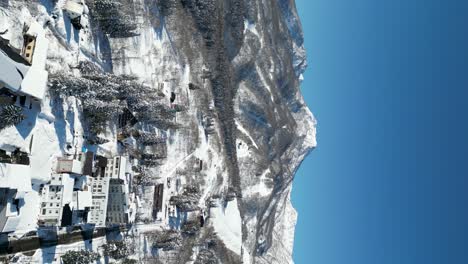 RIsing-aerial-view-of-Mount-Myoko-and-Akakura,-portrait-video