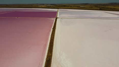 Aerial-drone-view-of-pathway-split-of-pink-salt-lake-Bumbunga-Lochiel-town-South-Australia-Port-Augusta-Adelaide-travel-tourism-4K-pan