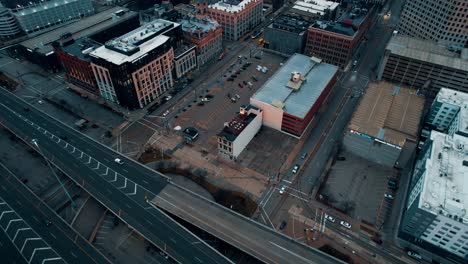 sunrise-aerial-of-milwaukee,-wisconsin-downtown,-above-Interstate-794-towards-Mitchell-building-with-a-cinematic-color-grade