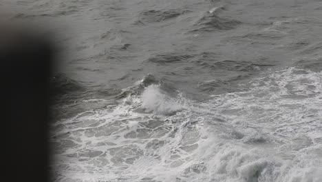 Waves-crashing-against-rough-shoreline