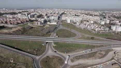 Altamura,-Italy-skyline-with-highway-and-traffic-with-drone-video-moving-forward