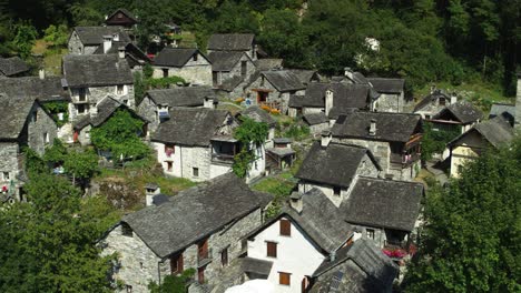 Wide-Aerial-of-the-Fairytale-Town-Foroglio-in-Switserland-during-Sunny-Weather