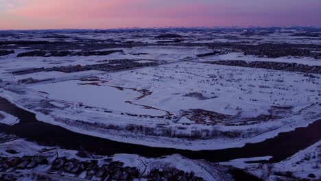 A-flying-drone's-perspective-of-a-beautiful-winter-sunrise-in-Calgary