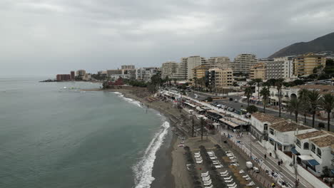 Low-Flying-Drone-Shot-of-a-Cloudy-Day-on-Portuguese-Beach-Town