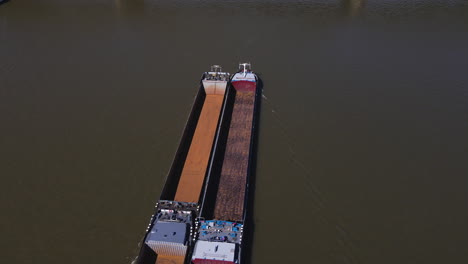 Cargo-boat-passes-underneath-Hohenzollern-Bridge-Cologne-Germany-Aerial