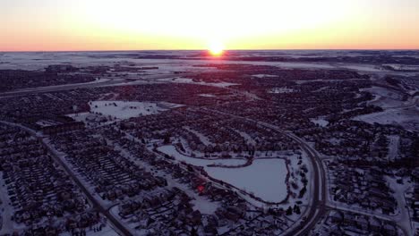 Drone-footage-of-Calgary's-houses-during-a-beautiful-winter-sunrise