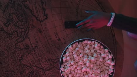 Popcorn-and-remote-control-on-the-table