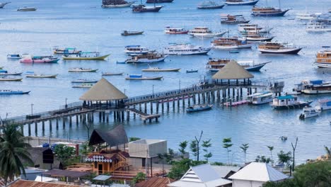 Labuan-Bajo-pier-and-marina-development-with-moored-boats-on-Flores-Island,-Nusa-Tenggara-region-of-east-Indonesia
