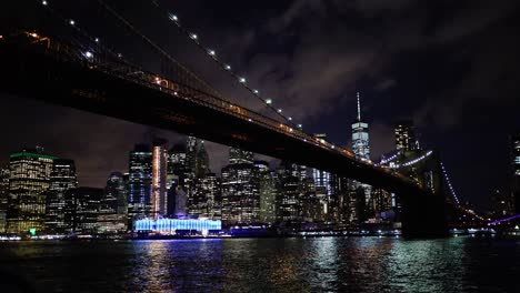 Manhattan-at-Night-with-Brooklyn-Bridge-in-Foreground