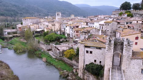 Aerial-view-of-the-town-of-Besalu-in-Catalonia,-Spain-during-a-cloudy-day