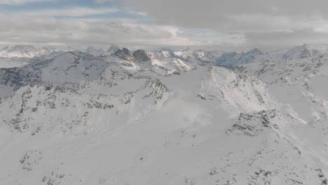 Switzerland:-view-of-famous-alpine-ski-resort-winter-Swiss-Alps,-snow-on-mountain-slopes