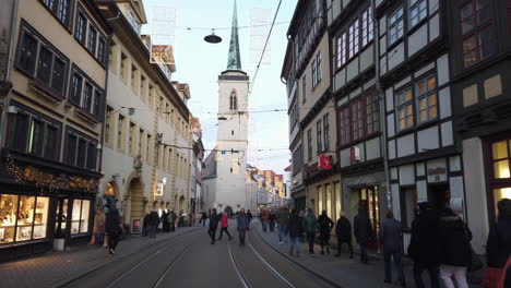 Pedestrian-Street-in-Erfurt-Old-Town-with-Tower-next-to-old-Building