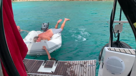a-man-jumping-and-crawling-onto-a-dinghy