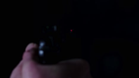 Point-of-view-of-9mm-pistol-firing-multiple-times-until-it-is-empty-in-a-dark-room
