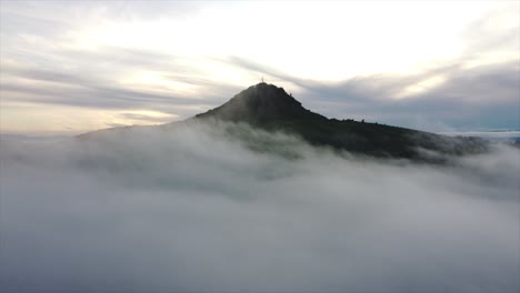 Aerial-shot-of-a-volcano-on-a-foggy-day