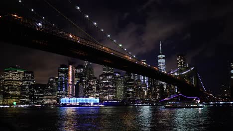 New-York-Skyline-at-Night-with-Brooklyn-Bridge-in-Foreground
