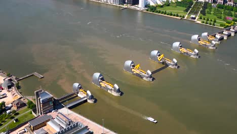 Aerial-view-of-the-Thames-Flood-Protection-Barrier-with-one-gate-closed-and-Control-centre