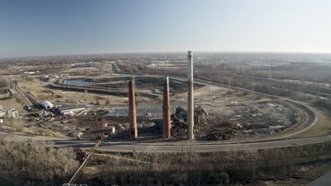 Drone-shot-of-demolished-coal-power-plant-with-smoke-stacks