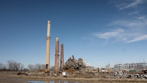 old-smoke-stacks-next-to-demolished-coal-fired-power-plant-ruins