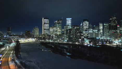 Aerial-drone-footage-of-the-downtown-skyline-of-Calgary-on-a-Winter-evening