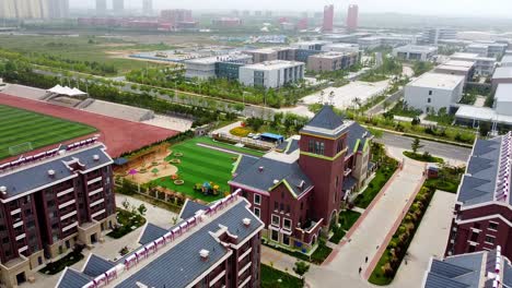 Aerial-view-of-a-playground-in-a-residential-complex-of-Nanhai-New-District,-China