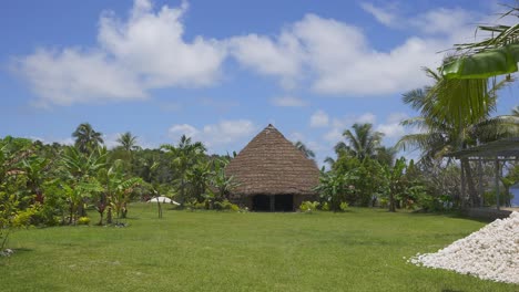 A-traditional-Kanak-house-nestled-within-a-lush-and-natural-environment-during-the-day